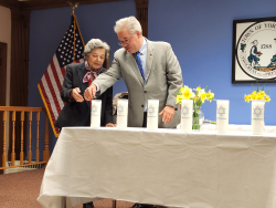 Esther Geizhals and Councilman Ed Lachterman light candles at Yorktown’s annual Holocaust Remembrance Ceremony on April 21, 2022